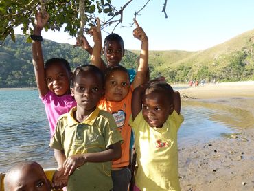 Local kids playing at one of the pristine estuaries on the route.