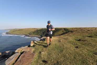 The trail hugs the spectacular Morgan Bay cliffs