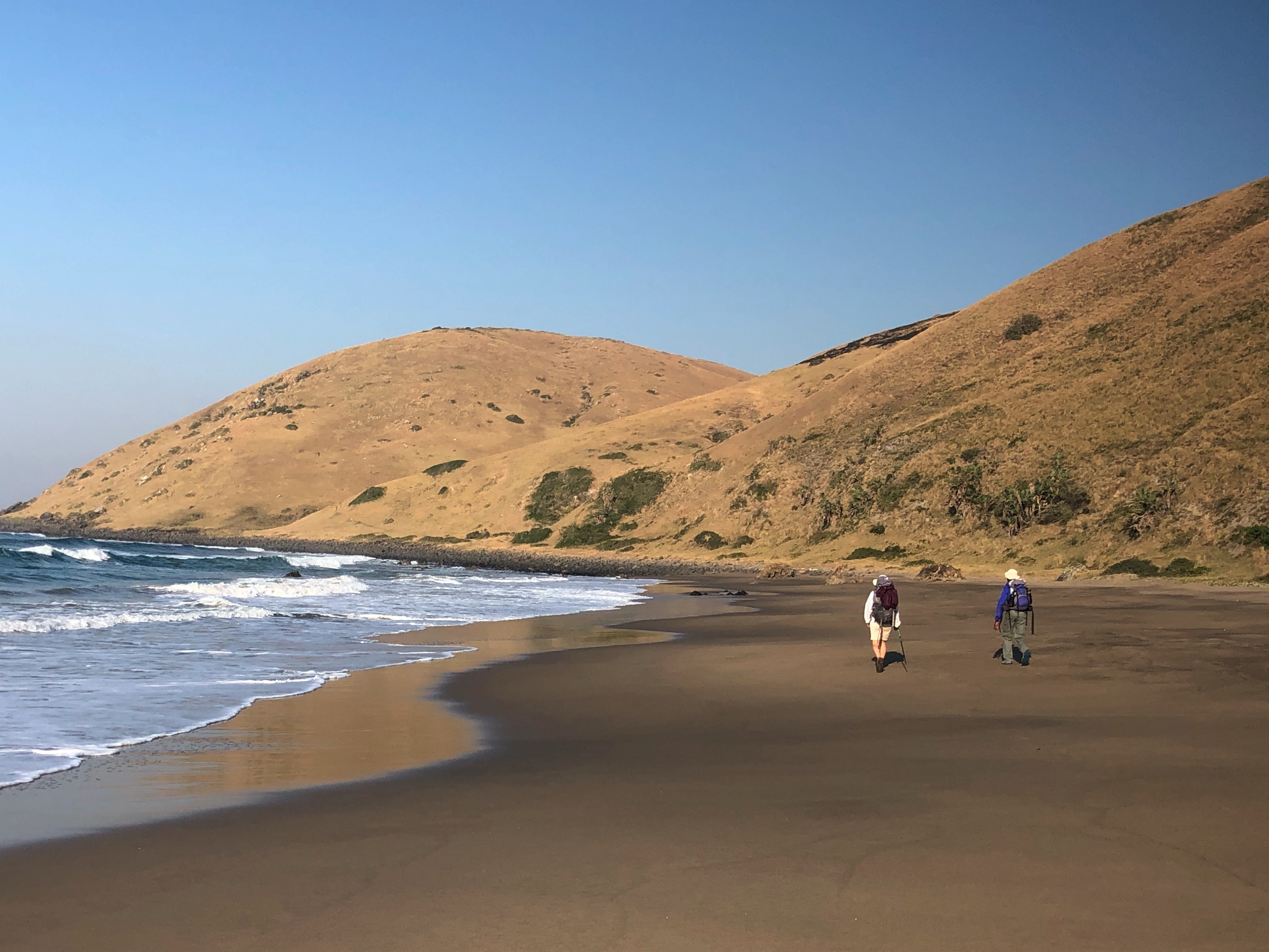 Expansive beach and sugar-loafed hills