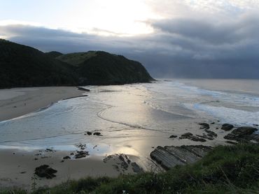 A bay at sunset on the Coffee Bay - Haven Hiking trail.