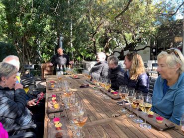 MCC cupcake pairing at Van Loveren, surrounded by lush gardens.