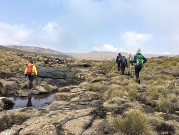 Headwaters of the Tugela river, as hikers make their way towards Mont-Aux-Sources –  one of the highest points of the Drakensberg range lying within Lesotho, the province of the Free State and KwaZulu-Natal.