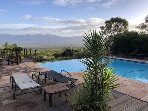 Rim-flow pool with a view across Walker Bay - Bellavista Country House